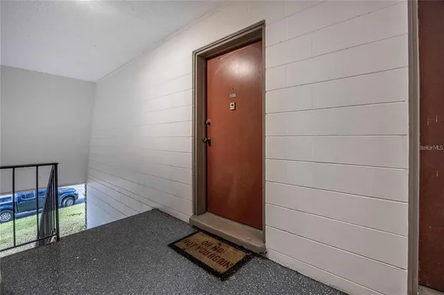 a view of an empty room and window