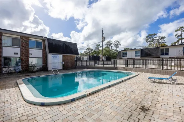 a view of a swimming pool with a chair