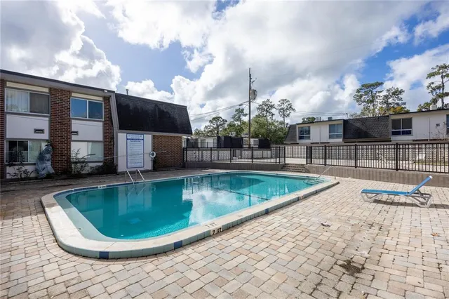 a view of a swimming pool with a chair