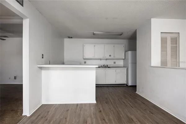 a utility room with cabinets washer and dryer