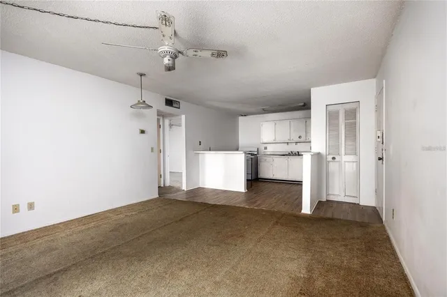 a view of a kitchen with a sink and cabinet area
