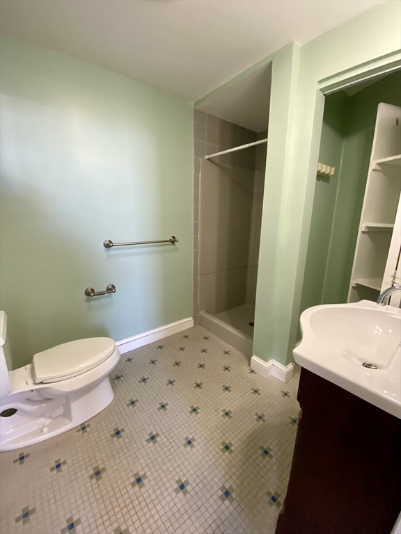 979 Chestnut Street, Unit 1 Newton, MA 02464 - Photo 6 of 6 a bathroom with a sink a toilet and shower