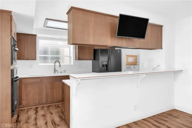 a close view of a sink and a microwave