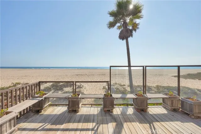 a view of an entryway with wooden floor and windows