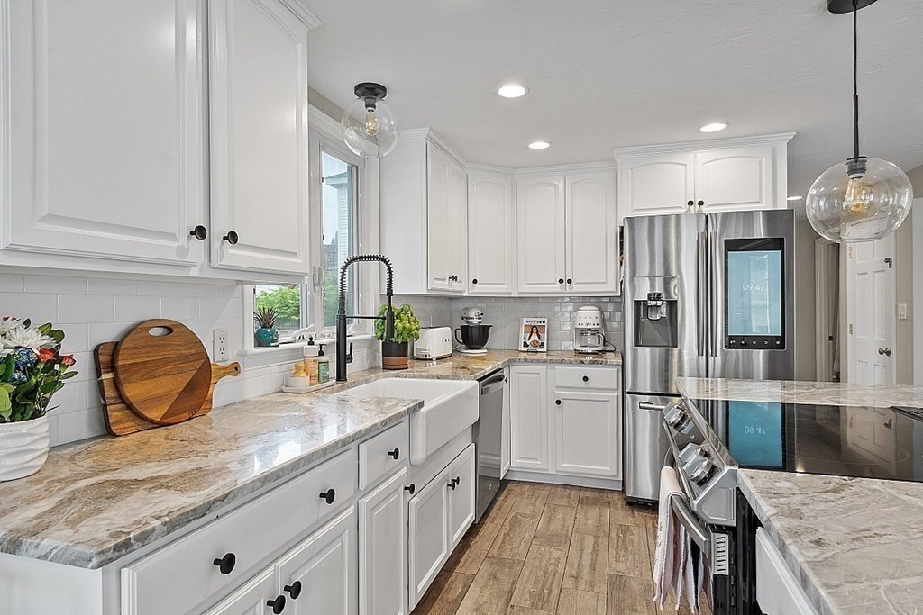 42 Ancona Road Worcester, MA 01604 - Photo 14 of 38 a kitchen with granite countertop a sink stainless steel appliances and cabinets