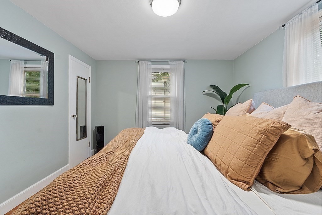 42 Ancona Road Worcester, MA 01604 - Photo 20 of 38 a bed sitting in a bedroom next to a window