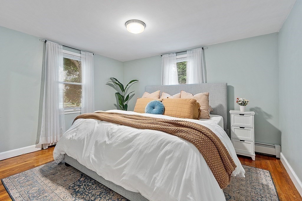 42 Ancona Road Worcester, MA 01604 - Photo 21 of 38 a bed sitting in a bedroom next to a window