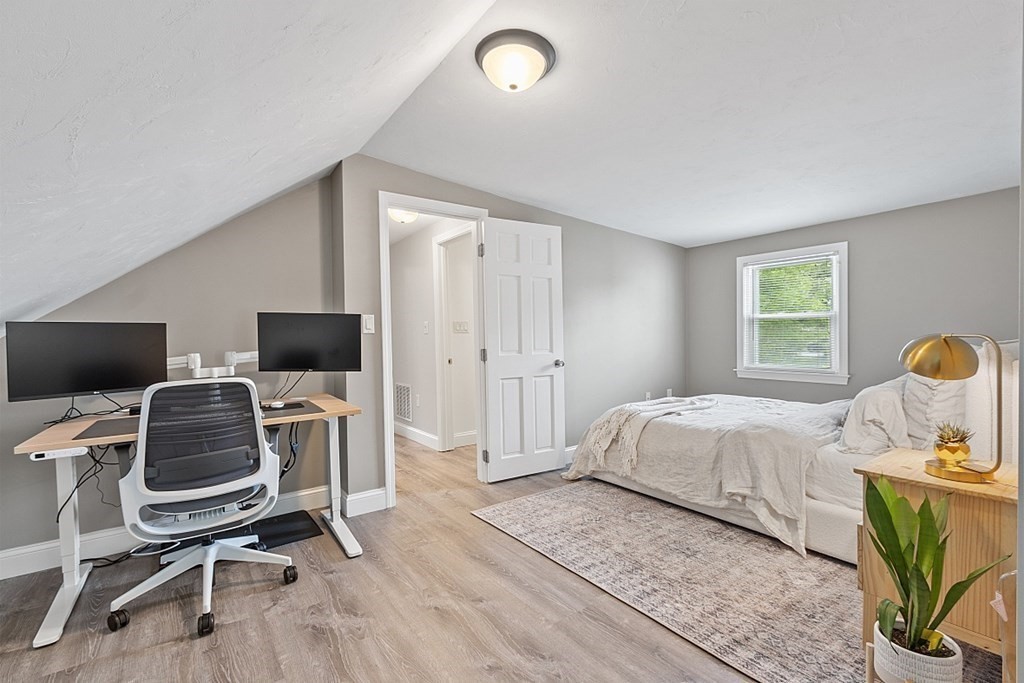 42 Ancona Road Worcester, MA 01604 - Photo 26 of 38 a bedroom with a bed and a computer on a desk