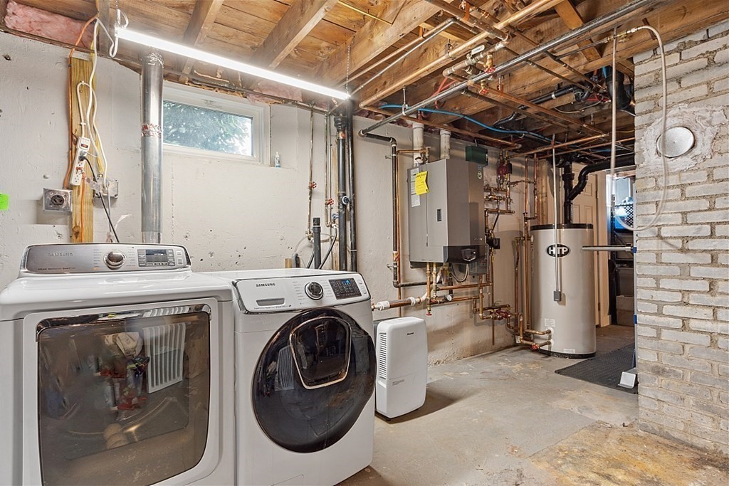 42 Ancona Road Worcester, MA 01604 - Photo 31 of 38 a utility room with dryer and washer