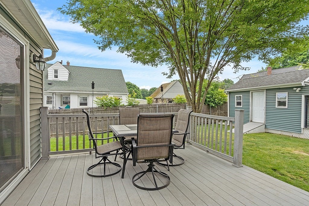 42 Ancona Road Worcester, MA 01604 - Photo 33 of 38 a view of a chair and table on the wooden deck