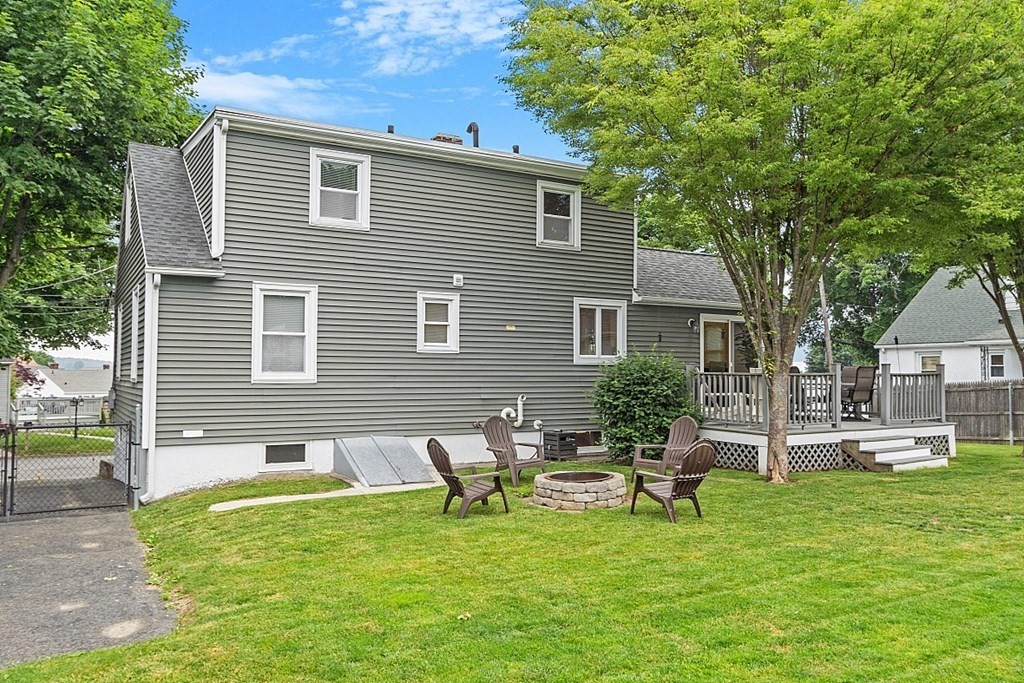 42 Ancona Road Worcester, MA 01604 - Photo 34 of 38 a backyard of a house with table and chairs