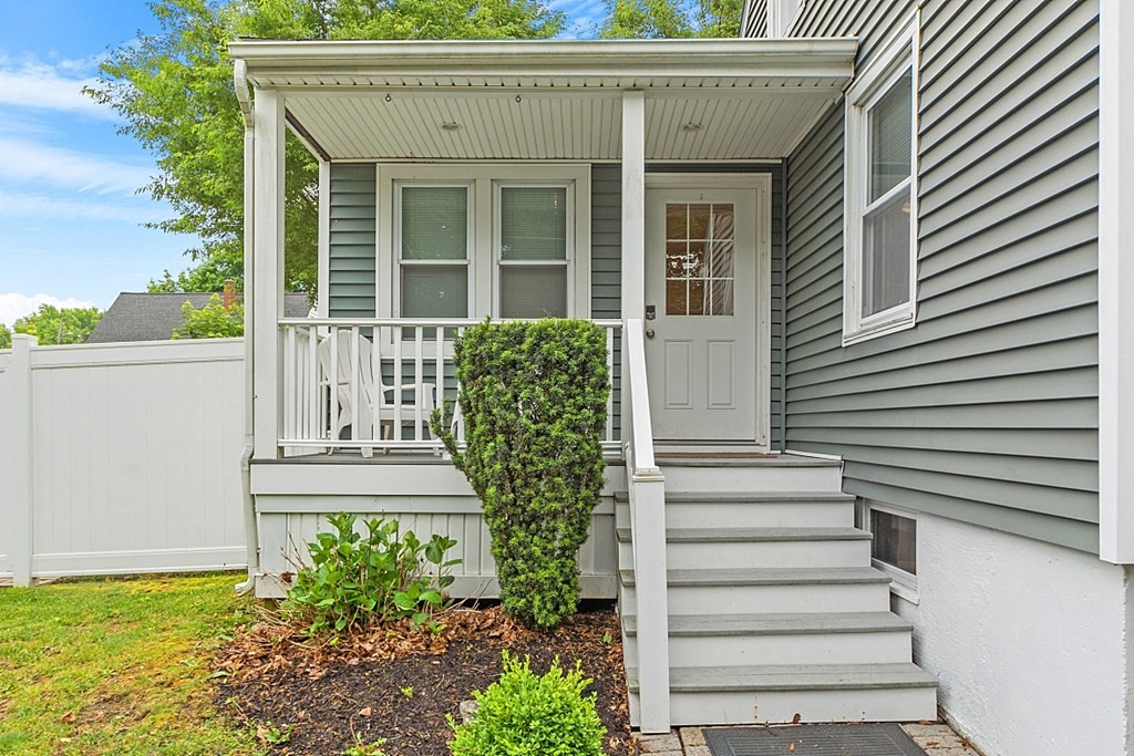 42 Ancona Road Worcester, MA 01604 - Photo 4 of 38 a view of a house with potted plants and a bench
