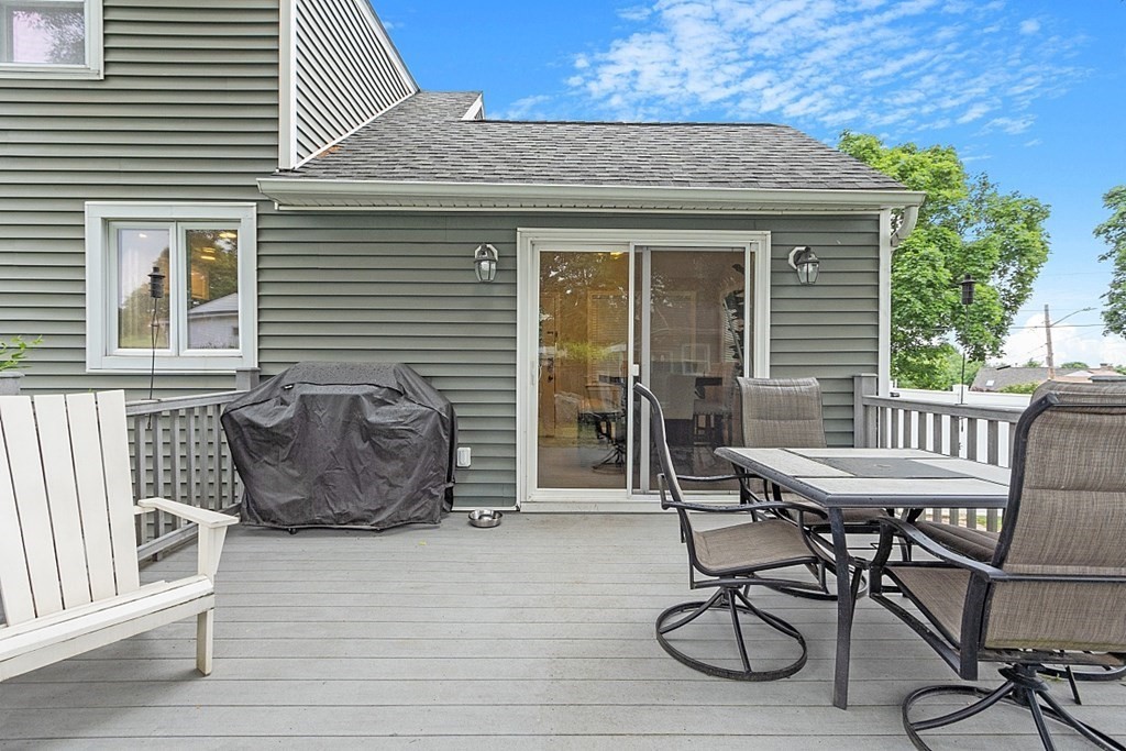 42 Ancona Road Worcester, MA 01604 - Photo 7 of 38 a balcony with table and chairs
