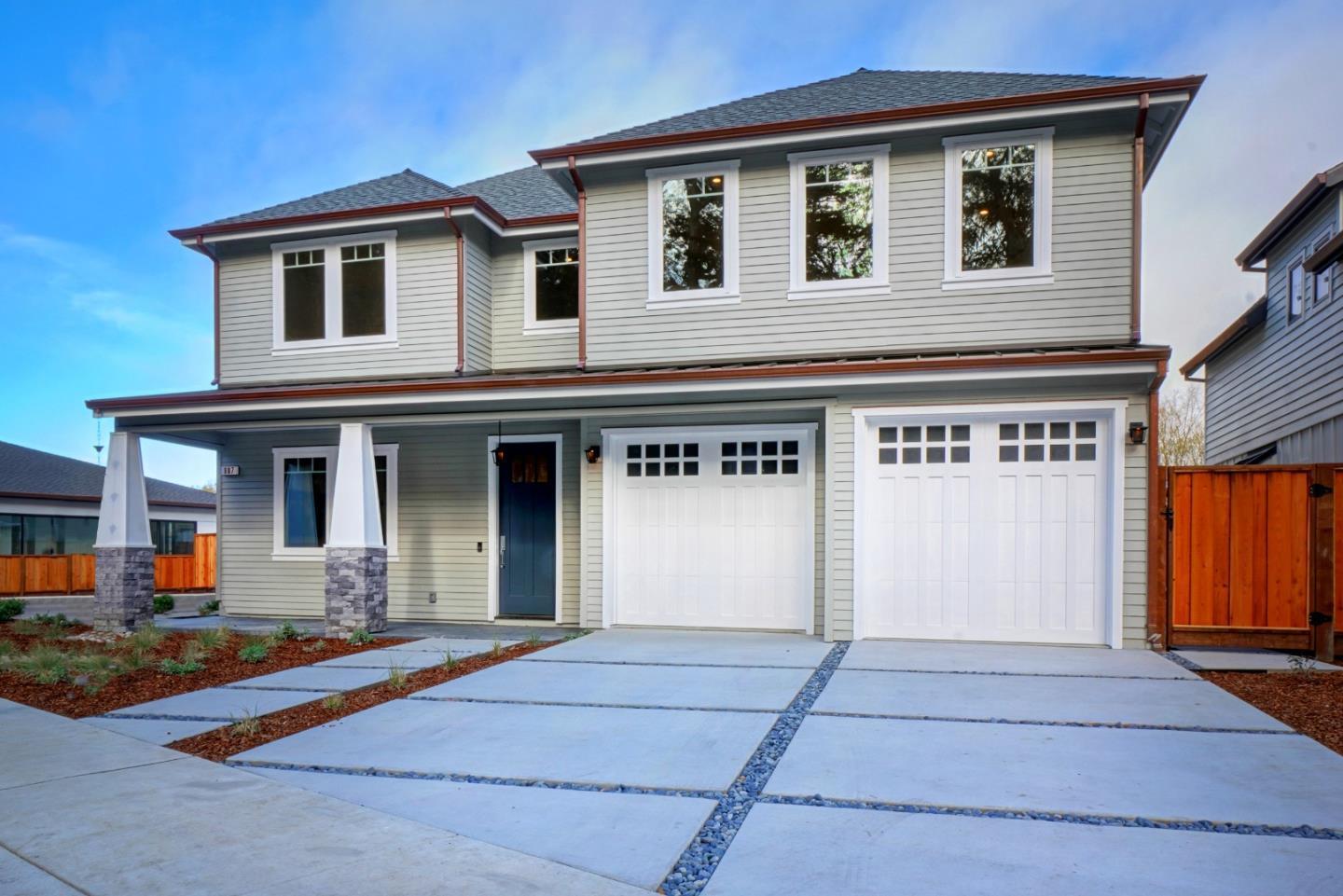 a front view of a house with yard