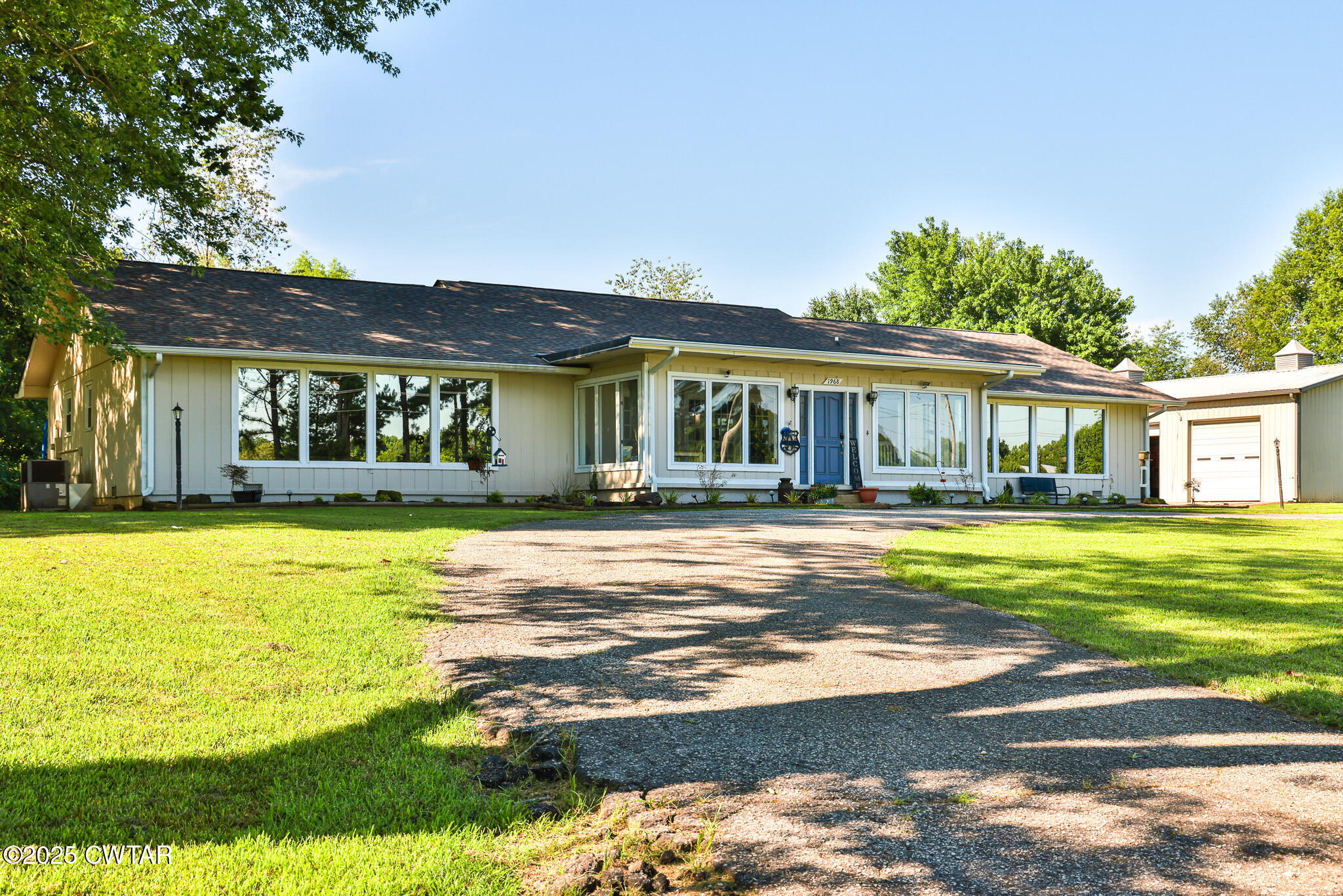 1968 Ralston Road Martin, TN 38237 - Photo 1 of 54 a front view of a house with swimming pool having outdoor seating