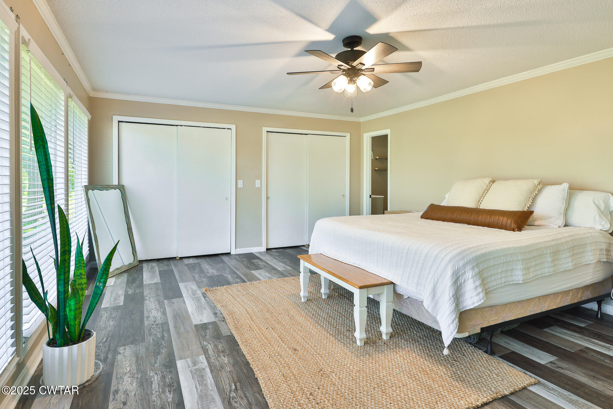 1968 Ralston Road Martin, TN 38237 - Photo 13 of 54 a spacious bedroom with a bed and a chandelier