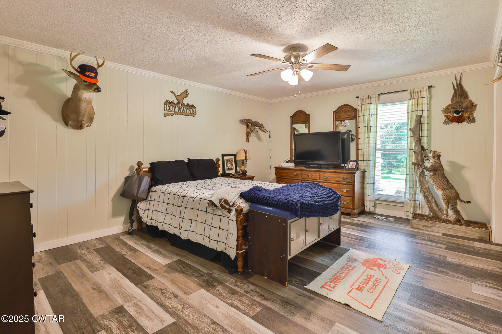 1968 Ralston Road Martin, TN 38237 - Photo 17 of 54 a bedroom with a large bed and a chandelier
