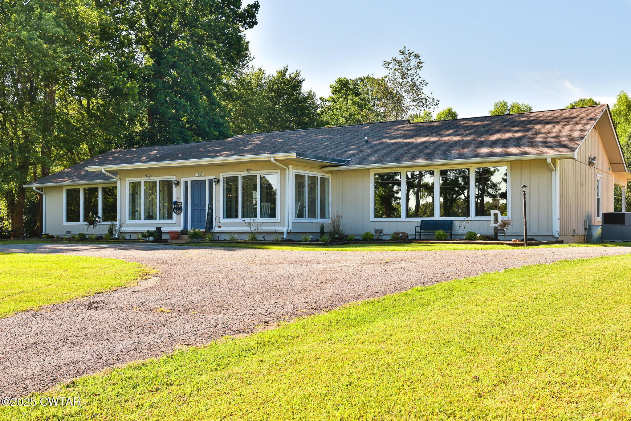 1968 Ralston Road Martin, TN 38237 - Photo 24 of 54 a house with swimming pool in front of it