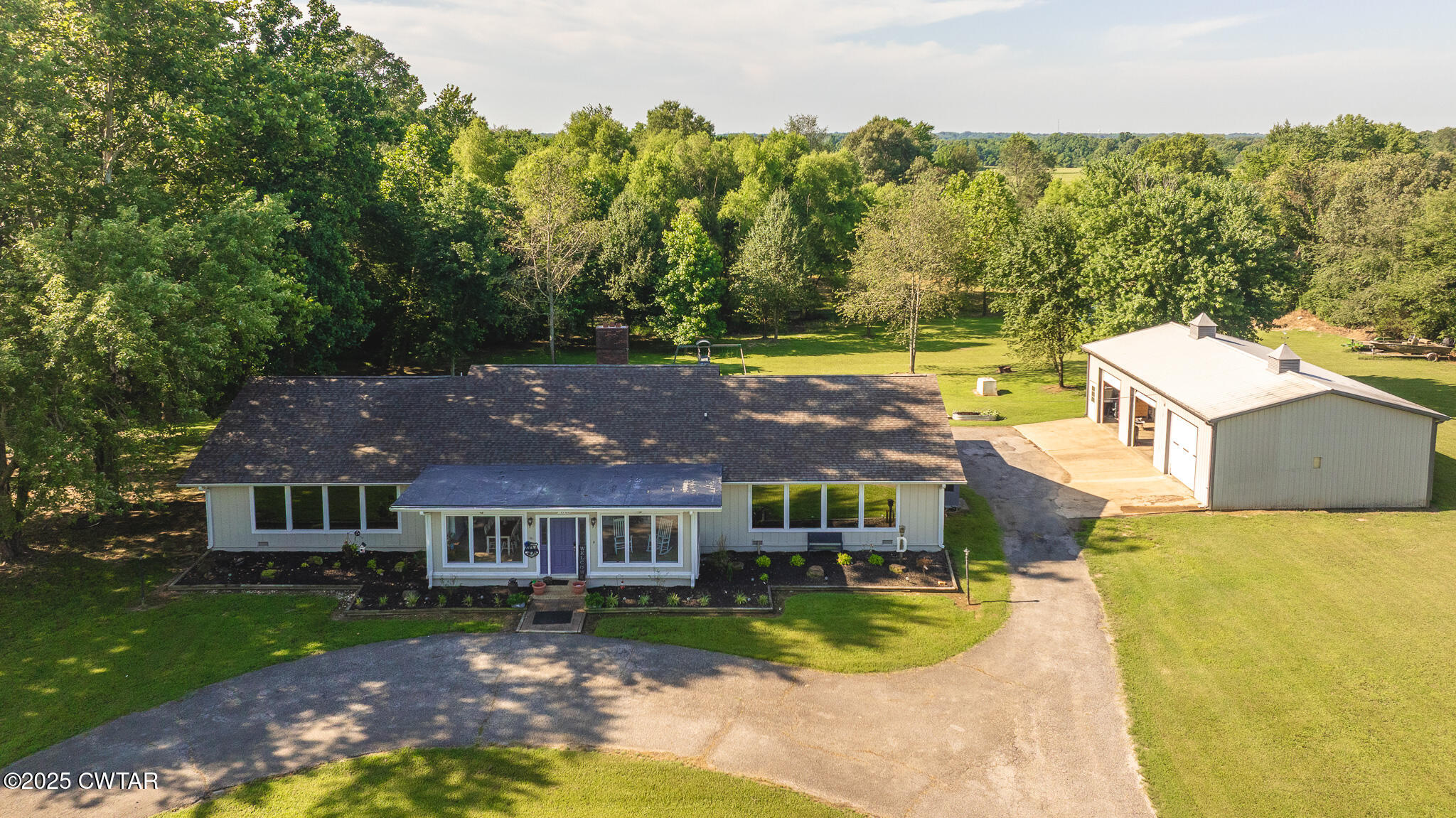 1968 Ralston Road Martin, TN 38237 - Photo 3 of 54 a aerial view of a house with swimming pool in front of big yard
