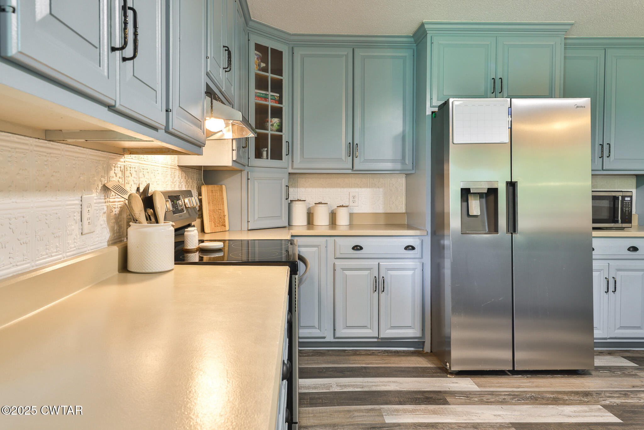1968 Ralston Road Martin, TN 38237 - Photo 5 of 54 a kitchen with stainless steel appliances granite countertop a refrigerator and a sink