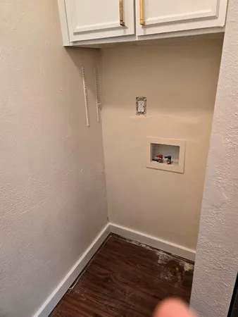 a view of a small space with wooden floor