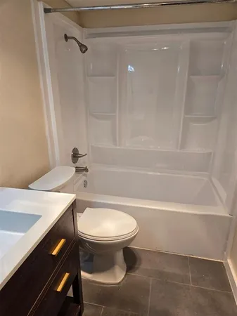 a bathroom with a sink a toilet and a bathtub