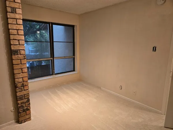 a bathroom with a toilet and a bathtub