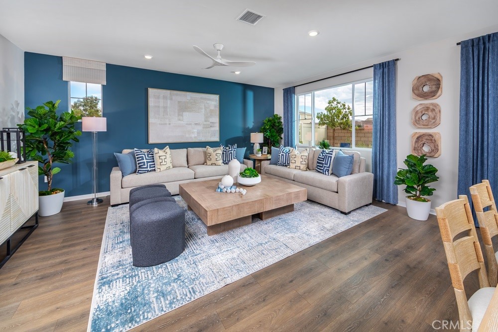 9573 Glenmore Frst Drive Riverside, CA 92508 - Photo 5 of 11 a living room with furniture potted plant and a window