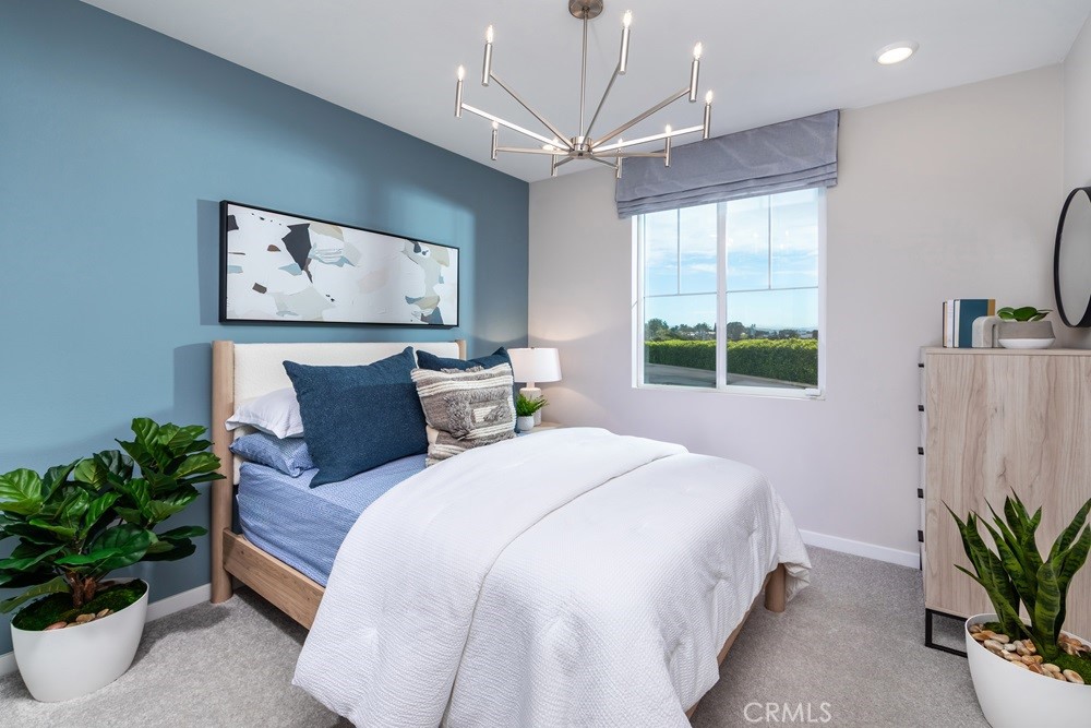 9573 Glenmore Frst Drive Riverside, CA 92508 - Photo 8 of 11 a bedroom with a large bed and a window