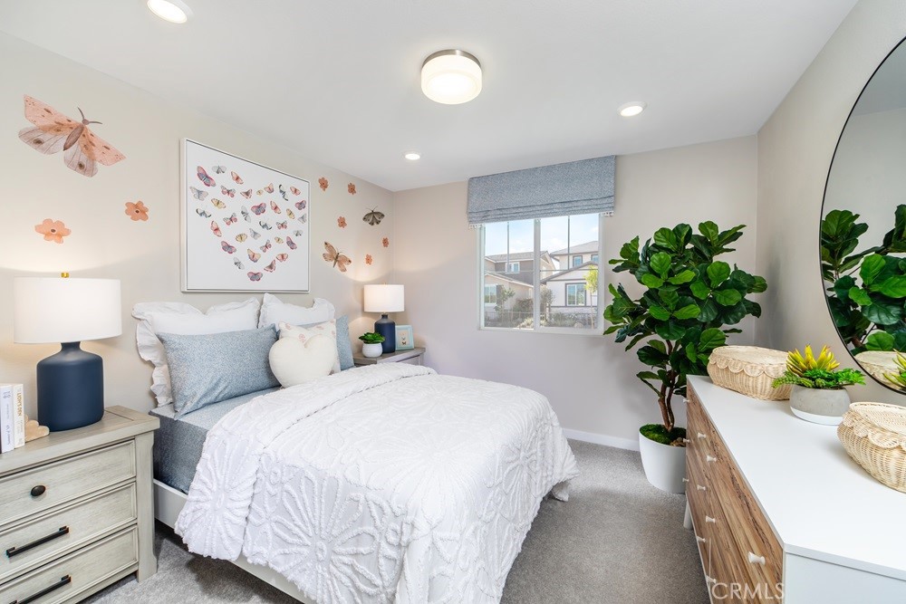 9573 Glenmore Frst Drive Riverside, CA 92508 - Photo 10 of 11 a bedroom with bed and a potted plant