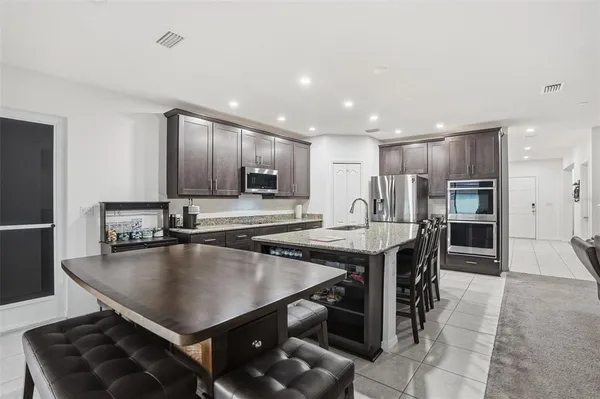a view of a livingroom with furniture and a flat screen tv