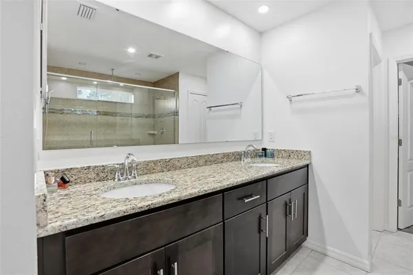 a living room with furniture gym equipment and a flat screen tv