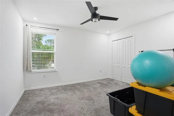 a bedroom with furniture and window