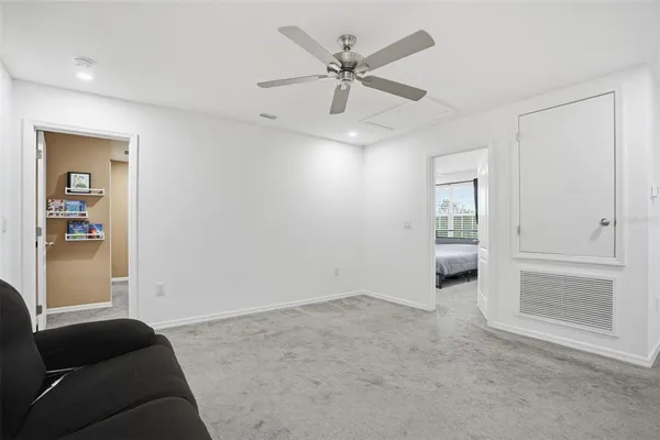 a view of a swimming pool with an outdoor seating and a yard