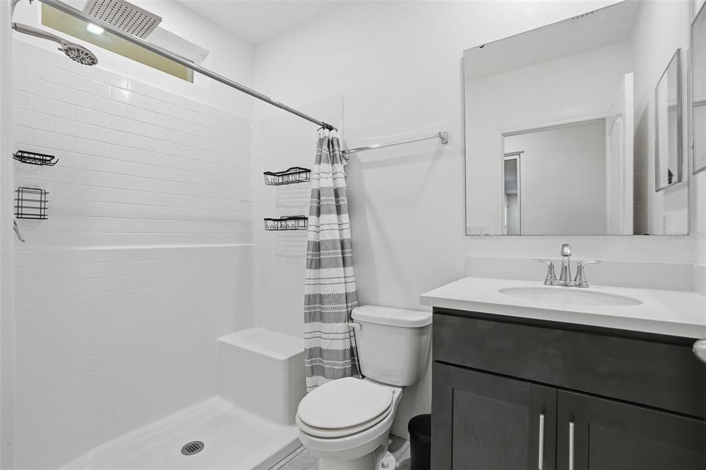 13286 Pendleton Street Spring Hill, FL 34609 - Photo 42 of 57 a bathroom with a sink a toilet and shower