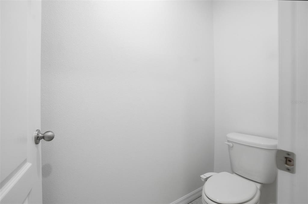 13286 Pendleton Street Spring Hill, FL 34609 - Photo 46 of 57 a white toilet sitting next to a white wall