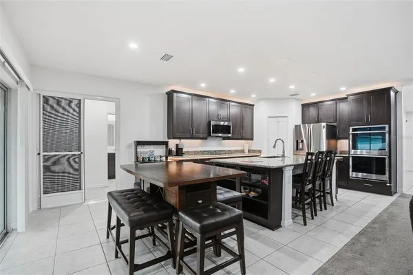 a en suite bathroom with a tub sink and mirror