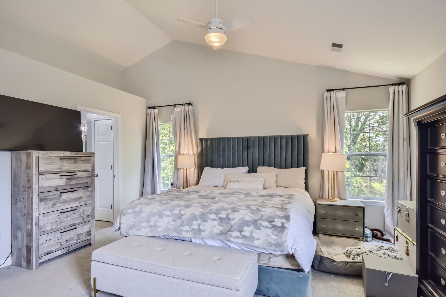 5244 Beech Ridge Road Nashville, TN 37221 - Photo 15 of 31 a bedroom with a bed and a flat tv screen