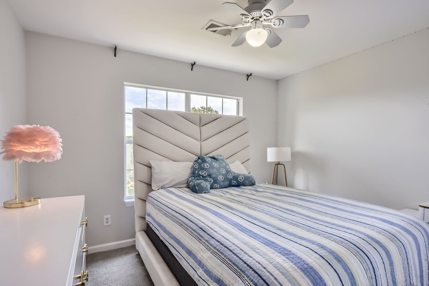 5244 Beech Ridge Road Nashville, TN 37221 - Photo 18 of 31 a bedroom with a bed and a chandelier