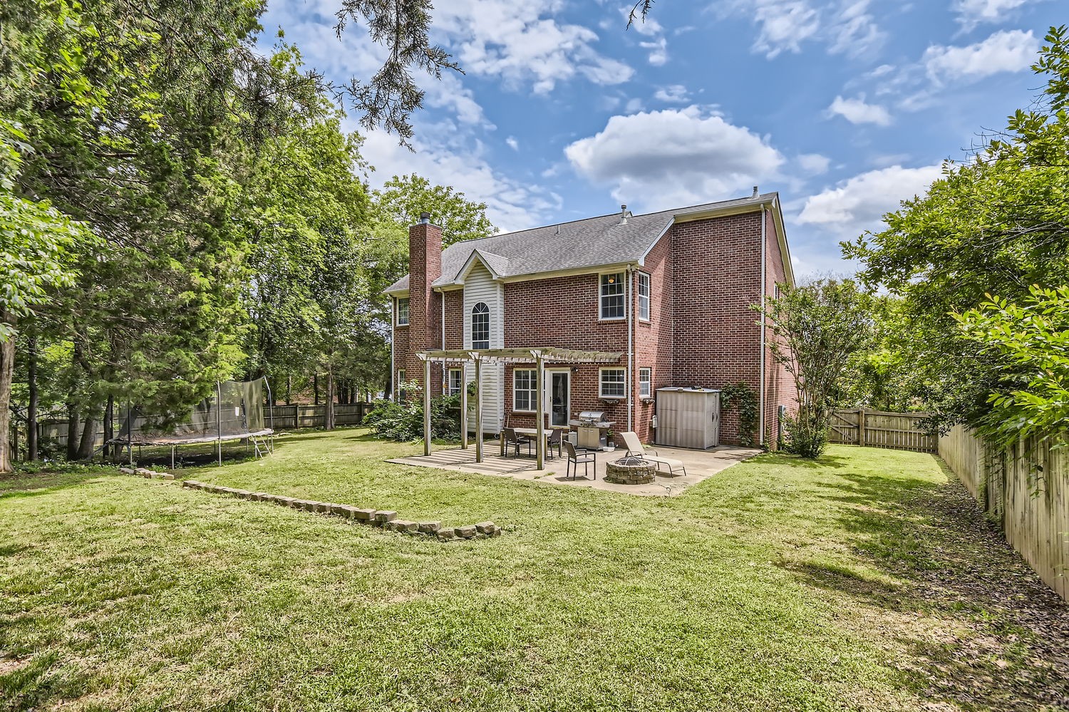 5244 Beech Ridge Road Nashville, TN 37221 - Photo 26 of 31 a backyard of a house with yard and outdoor seating
