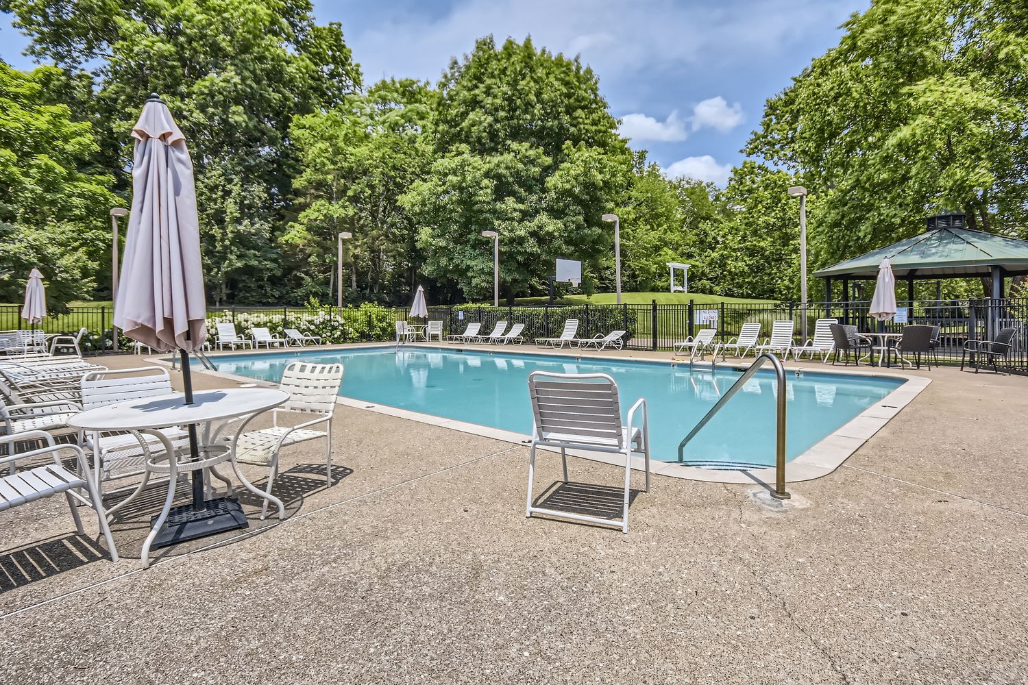 5244 Beech Ridge Road Nashville, TN 37221 - Photo 28 of 31 a view of a swimming pool with chairs in patio