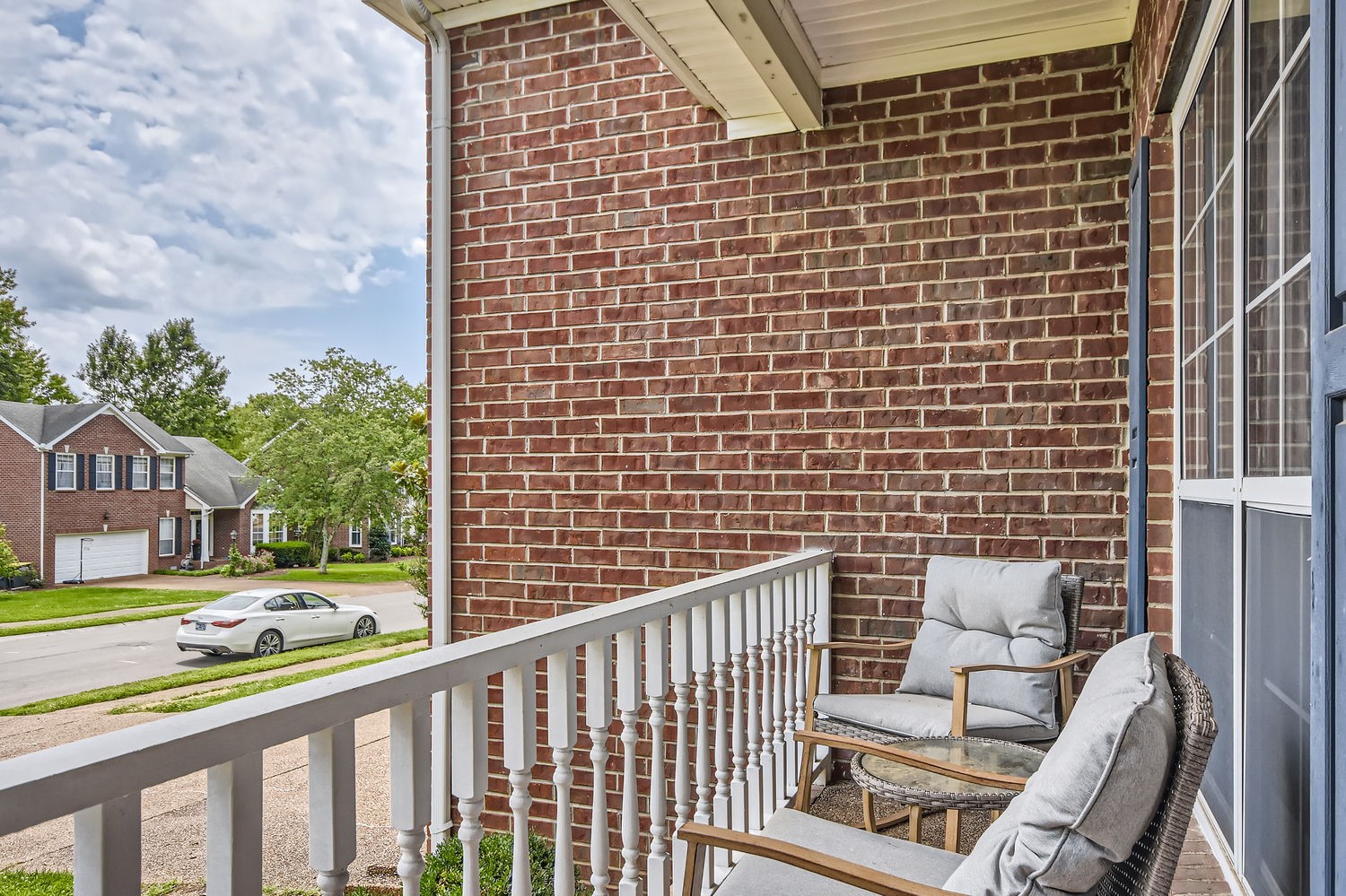 5244 Beech Ridge Road Nashville, TN 37221 - Photo 4 of 31 a view of a balcony with a chair and floor to ceiling window