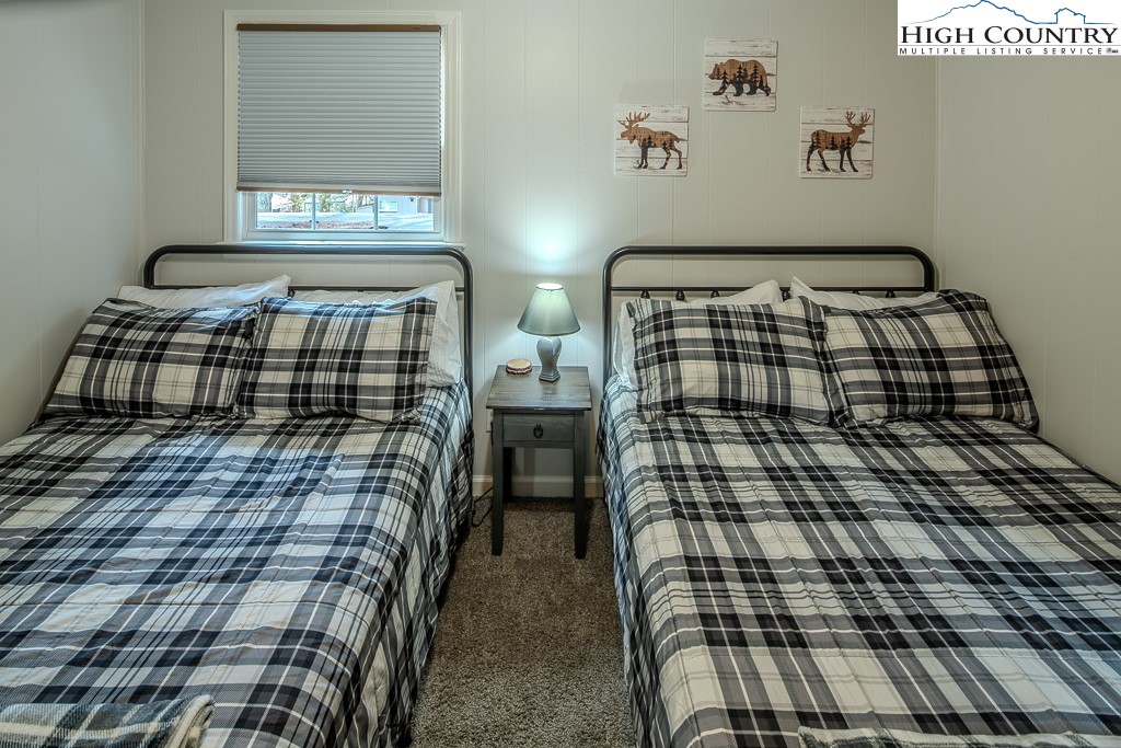 198 Black Pine Road Newland, NC 28657 - Photo 24 of 34 a bedroom with a bed and window
