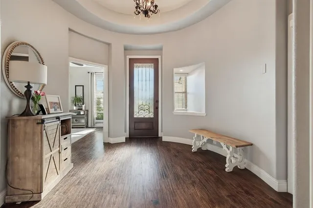 a view of a livingroom with furniture hardwood floor and a view of a livingroom