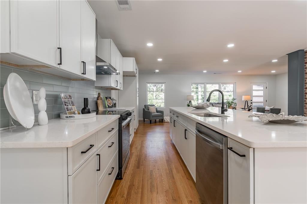 2651 Pangborn Road Decatur, GA 30033 - Photo 12 of 31 a kitchen with counter space sink appliances and cabinets