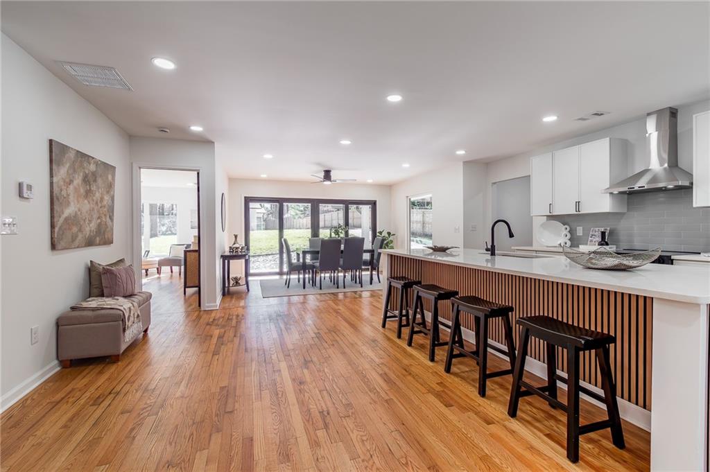 2651 Pangborn Road Decatur, GA 30033 - Photo 14 of 31 a living room with furniture a wooden floor and a kitchen
