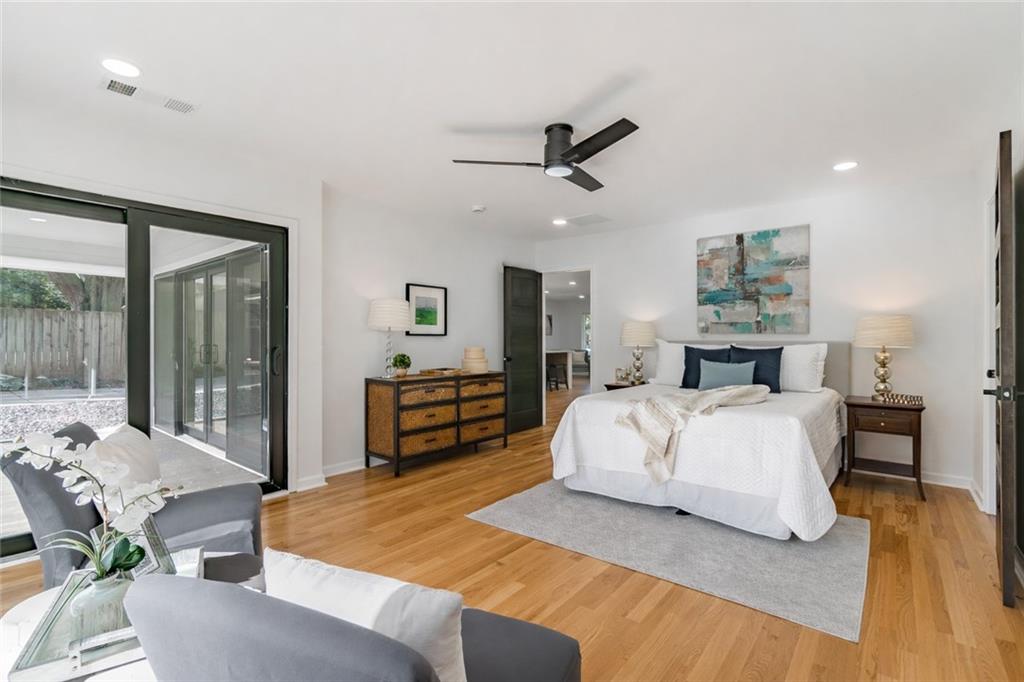 2651 Pangborn Road Decatur, GA 30033 - Photo 15 of 31 a spacious bedroom with a bed and wooden floor
