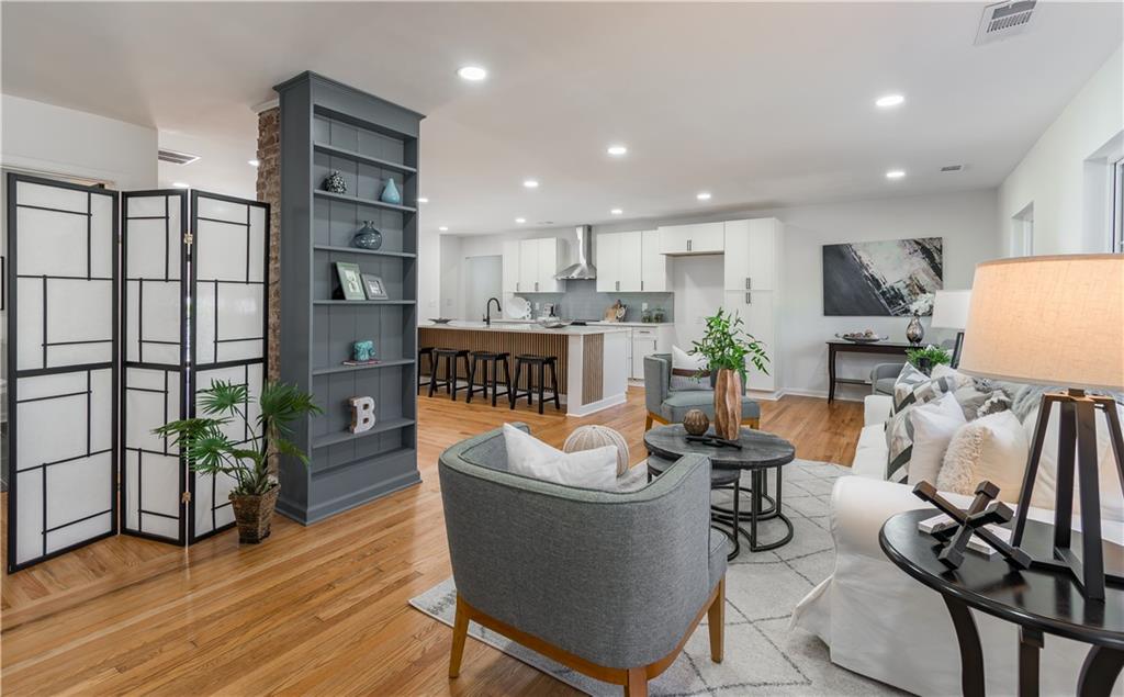 2651 Pangborn Road Decatur, GA 30033 - Photo 2 of 31 a living room with furniture a dining table and a potted plant