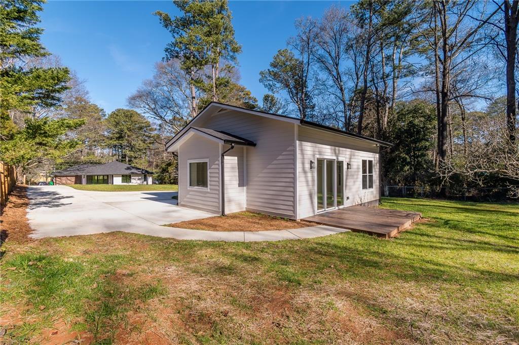 2651 Pangborn Road Decatur, GA 30033 - Photo 23 of 31 a view of a house with pool and trees in the background