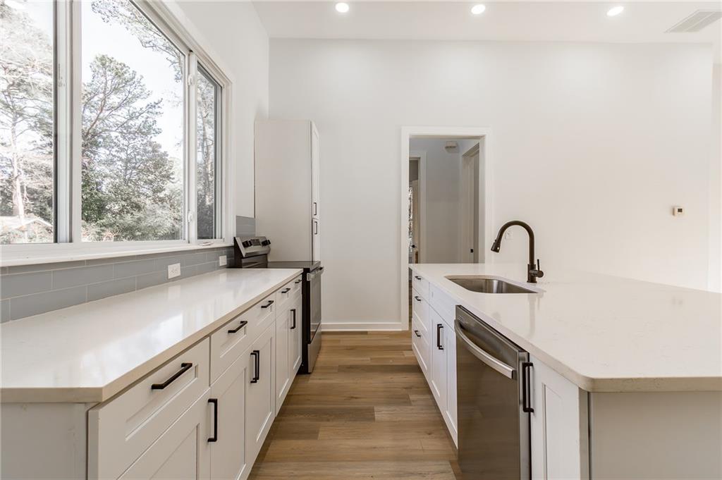 2651 Pangborn Road Decatur, GA 30033 - Photo 25 of 31 a large white kitchen with a large window